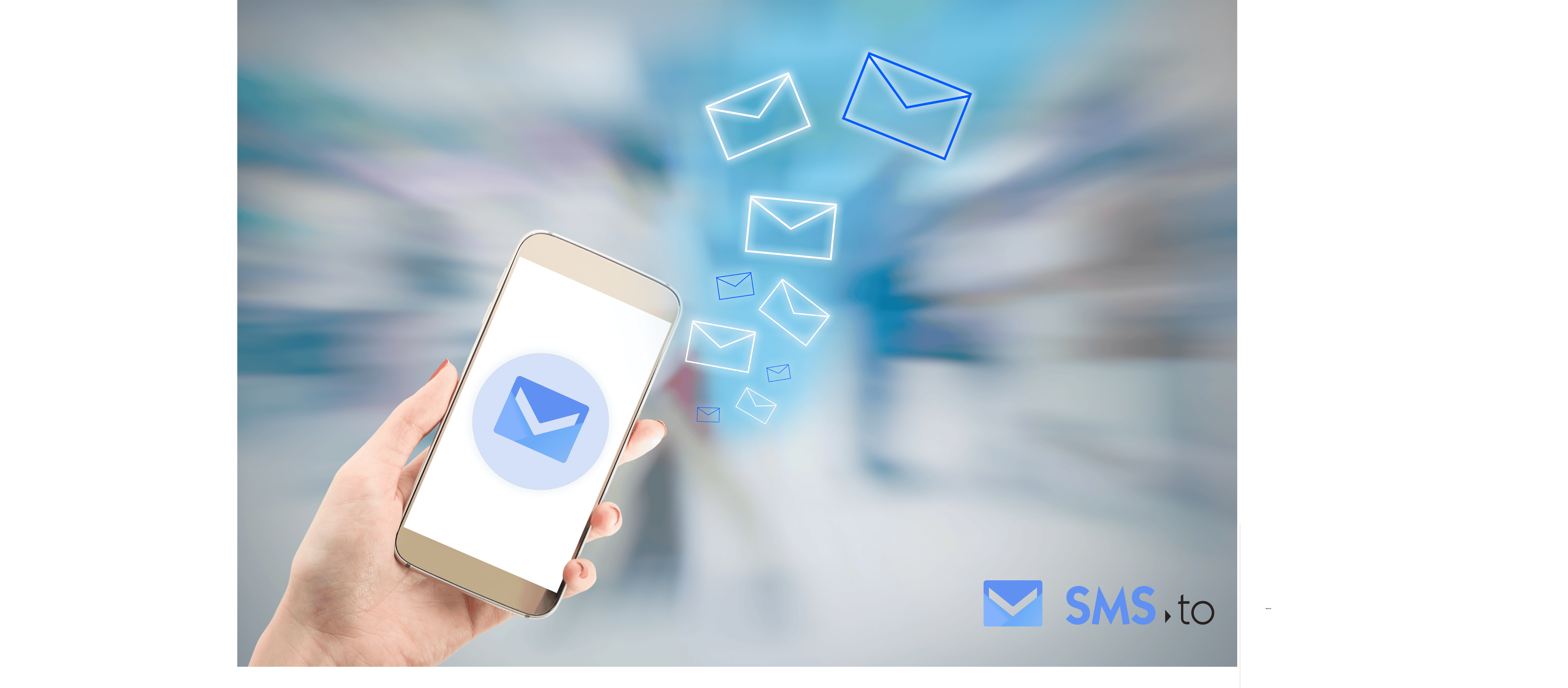 A hand holding a phone with the logo of sms.to and above it a large number of messages flying away.